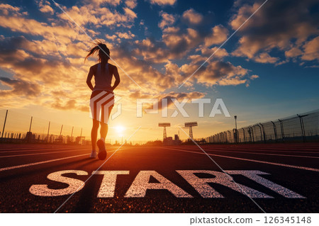 start word written on athletics track and athlete woman runner. at sunset for challenge and change. planning health and the goal to success. 126345148