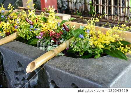 A flower water basin decorated with colorful flowers A flower water basin decorated with colorful flowers 126345429
