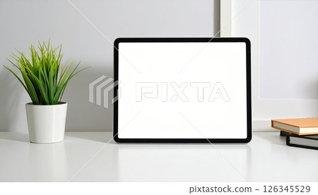 《AI image》Tablet device placed on a desk 126345529