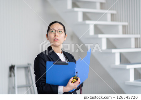 A career woman checking out a property A career woman checking out a property 126345720