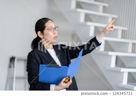A career woman checking out a property A career woman checking out a property 126345721