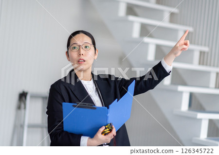 A career woman checking out a property A career woman checking out a property 126345722