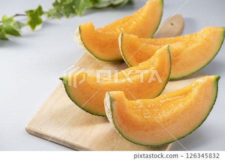 Fresh, sweet and delicious melons harvested from the field Fresh, sweet and delicious melons harvested from the field 126345832