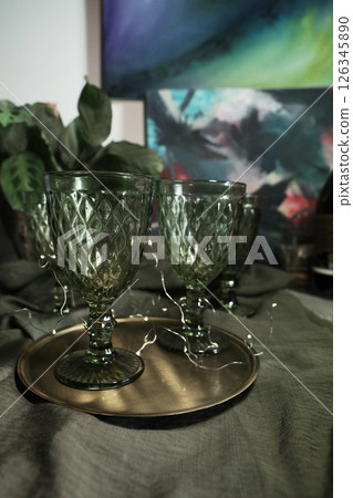 elegant green drinking set of glasses on a golden tray 126345890