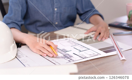 Architect Creating Blueprint Design for Building Project With Ruler and Pencil Hands of Asian Adult Architect Working on Building Project Design Architect Creating Blueprint Design for Building Project With Ruler and Pencil Hands of Asian Adult Architect Working on Building Project Design 126346078