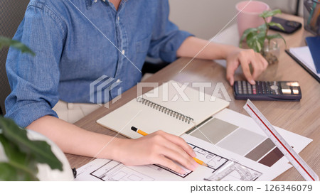 Asian Women Hand Interior Designer Hands Working Architectural Plan Asian Women are Designing House Plan and Using Calculator for Cost Estimation Interior Designing 126346079