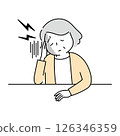The upper body of a menopausal woman holding her temples due to a headache 126346359