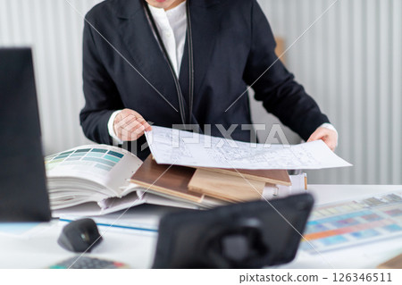 A female employee checking construction documents 126346511