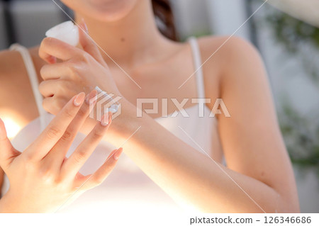 Closeup young asian woman presenting and review cosmetic product on social media. Closeup young asian woman presenting and review cosmetic product on social media. 126346686