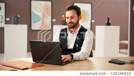 Art gallery, internet and man with laptop, typing and email for project funding, expo curation and exhibition plan. Creative, manager or curator with PC, website update or budget report with research 126346810