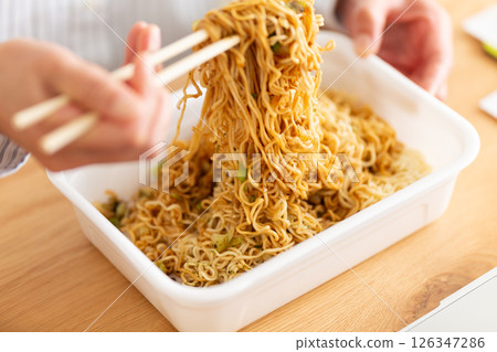 Hands of a middle-aged woman eating cup noodles 126347286