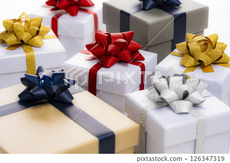 A collection of gift boxes lined up on a white background 126347319