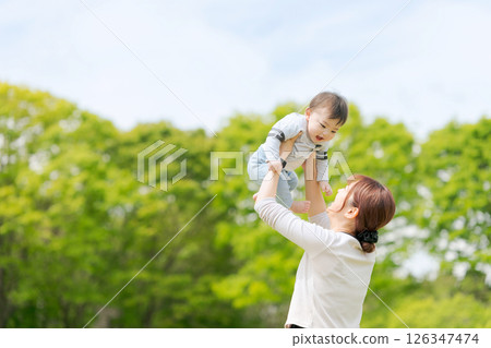 Baby carried by mother 126347474