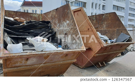 Full construction containers collecting waste materials Full construction containers collecting waste materials 126347567