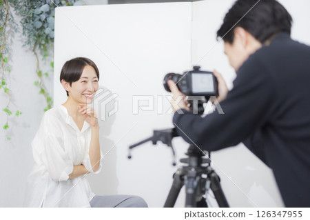 Male cameraman taking a video Male cameraman taking a video 126347955