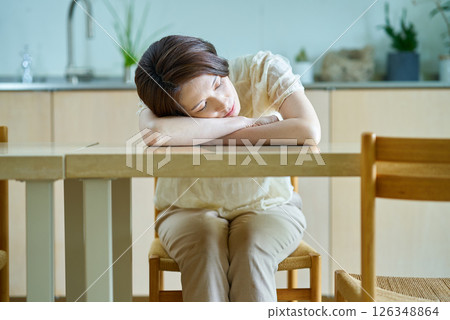 Woman resting in a room Woman resting in a room 126348864