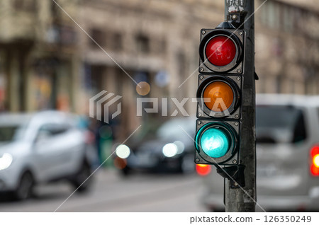 traffic light on the street junction with beautiful bokeh, city with cars in the background traffic light on the street junction with beautiful bokeh, city with cars in the background 126350249