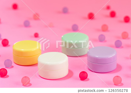 Small and colorful plastic cosmetic jars Small and colorful plastic cosmetic jars 126350278