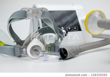 CPAP machine with mask and hose, for people with sleep apnea, respiratory, or breathing disorder 126350393