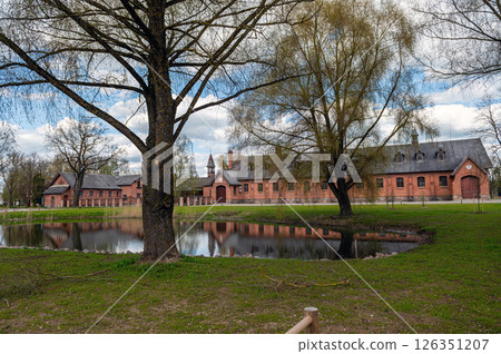Zagare manor stables on a sunny spring day, Lithuania Zagare manor stables on a sunny spring day, Lithuania 126351207