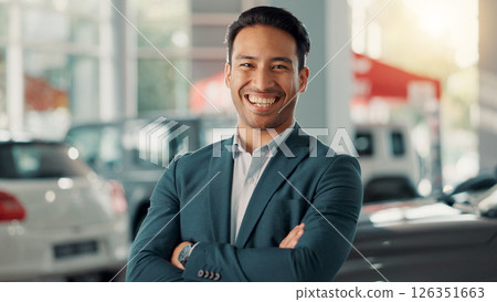 Businessman, portrait and laugh with confidence for car dealership, customer service and transport for rental. Showroom, male person and seller with arms crossed for assistance, vehicle shop or smile 126351663