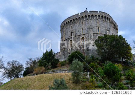 Focused architectural view of Windsor Castle's historic towers and walls in England. Captured in winter with soft light and no people in the frame. Focused architectural view of Windsor Castle's historic towers and walls in England. Captured in winter with soft light and no people in the frame. 126351693
