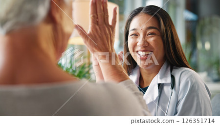 Happy woman, healthcare and high five with senior patient for winning, good job or teamwork at hospital. Excited, female person or touch with smile for elderly care, success or positivity at clinic 126351714