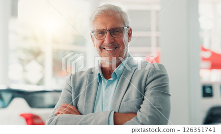Businessman, portrait and smile with confidence for dealership, pride and customer service for car rental. Showroom, mature person and seller with arms crossed for assistance, vehicle shop and happy 126351741