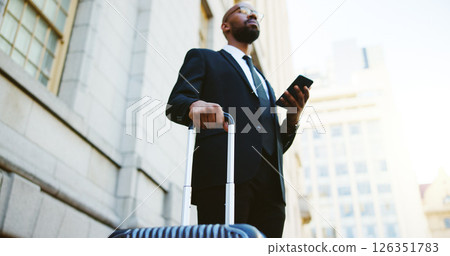Suitcase, travel and black man in city with cellphone for communication, contact or email. Phone, corporate trip and African male finance manager with business networking in urban town from low angle Suitcase, travel and black man in city with cellphone for communication, contact or email. Phone, corporate trip and African male finance manager with business networking in urban town from low angle 126351783