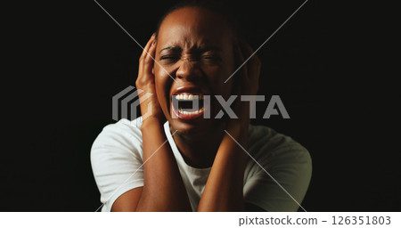 Woman, screaming and stress in studio with anxiety, panic and mental health by black background. African girl, crying and shouting with depression, frustrated and lonely with trauma, ptsd and dark Woman, screaming and stress in studio with anxiety, panic and mental health by black background. African girl, crying and shouting with depression, frustrated and lonely with trauma, ptsd and dark 126351803
