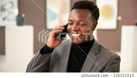 Art, phone call and smile with black man in museum for exhibition or networking as curator. Communication, conversation and planning with happy African person in gallery for expo, showcase or vision 126351819