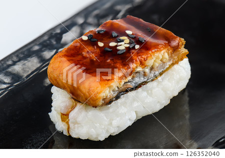 Grilled eel sushi with sweet sauce and sesame Grilled eel sushi with sweet sauce and sesame 126352040
