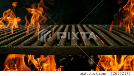 Hot empty portable barbecue BBQ grill with flaming fire and ember charcoal on black background. Waiting for the placement of your food. 126352171