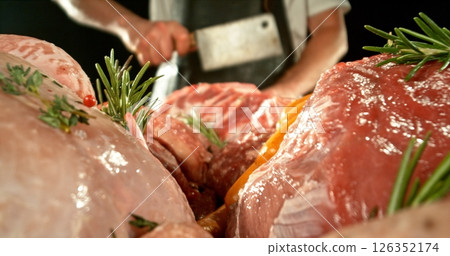 Fresh butcher cut meat assortment. Raw Various Kinds of Meat Served on a Table. Preparation of Meat. Isolated on Black Background. Fresh butcher cut meat assortment. Raw Various Kinds of Meat Served on a Table. Preparation of Meat. Isolated on Black Background. 126352174