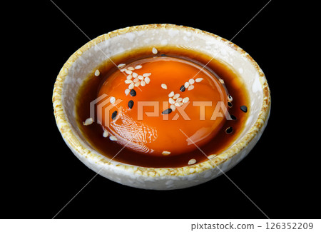 Soft-boiled egg in soy sauce with sesame 126352209