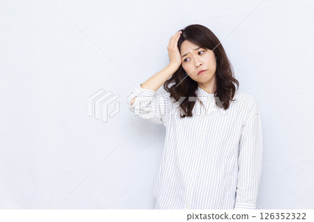 A woman with a headache A woman with a headache 126352322
