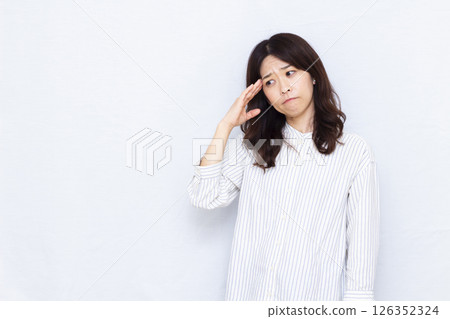 A woman with a headache A woman with a headache 126352324