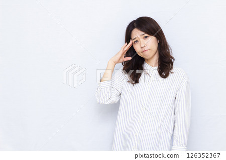 A woman with a headache A woman with a headache 126352367