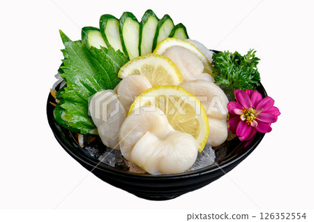 Scallop sashimi with cucumber, lemon, and flower garnish on ice 126352554