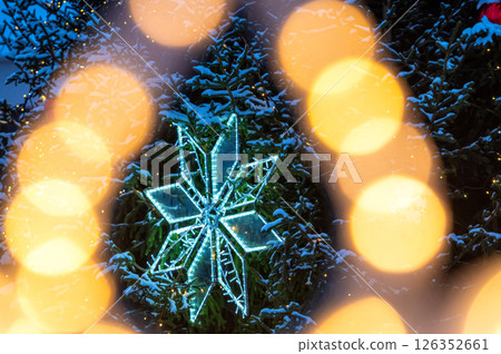 Christmas tree with yellow garlands lights and bokeh copy space 126352661