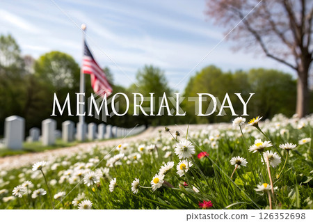 Memorial Day cemetery landscape with American flag waving in background, patriotic holiday remembrance scene with bright blue sky and spring greenery 126352698