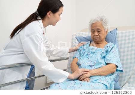 Asian doctor checking and treat elderly woman patient health in hospital. 126352863