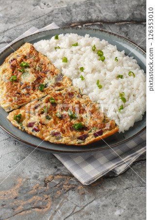 Spicy Kerala coconut ginger omelette Motta Porrichu with rice closeup on the plate. Vertical Spicy Kerala coconut ginger omelette Motta Porrichu with rice closeup on the plate. Vertical 126353010