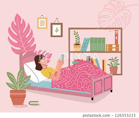 woman lying in bed holding phone in hand watching phone 126353215