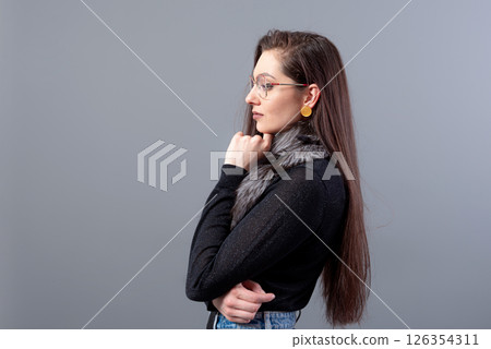 portrait of sensual woman in glasses with long hair against gray background portrait of sensual woman in glasses with long hair against gray background 126354311