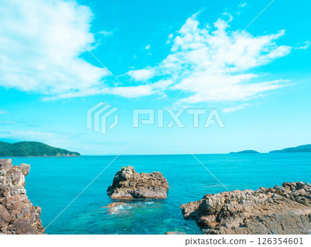 Blue sea and rocky coastline 126354601