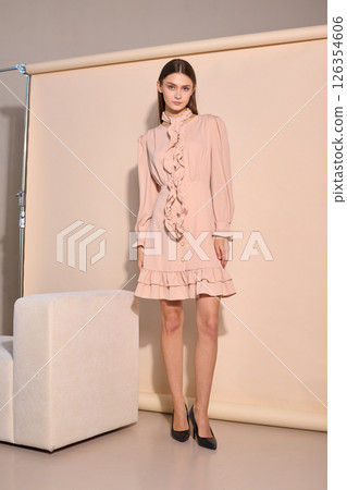 beautiful fashion female model in short beige dress 126354606
