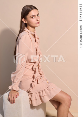 beautiful fashion female model in short beige dress beautiful fashion female model in short beige dress 126354611