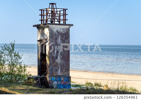The old fishermen's lighthouse on Ragaciema beach, built in 1875, destroyed during the war The old fishermen's lighthouse on Ragaciema beach, built in 1875, destroyed during the war 126354961
