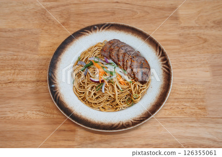 Noodles with sliced meat and vegetables 126355061